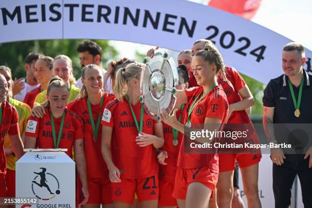 Giulia Gwinn of FC Bayern München celebrates with the Meisterschale of Bundesliga trophy after their team`s victory during the Google Pixel Women's...