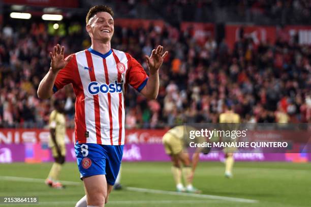Girona's Ukrainian forward Viktor Tsygankov celebrates scoring his team's second goal during the Spanish league football match between Girona FC and...
