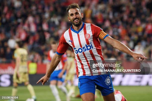 Girona's Uruguayan forward Cristhian Stuani celebrates scoring his team's sixth goal during the Spanish league football match between Girona FC and...