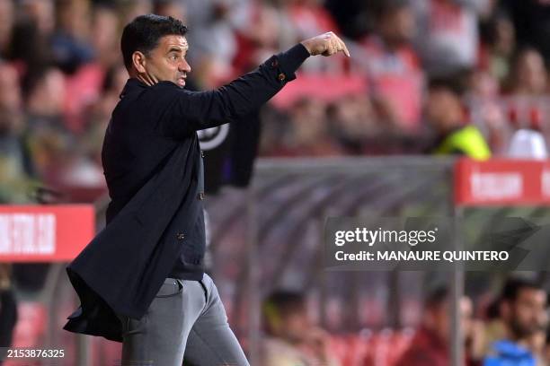 Girona's Spanish coach Michel gestures during the Spanish league football match between Girona FC and Granada FC at the Montilivi stadium in Girona...