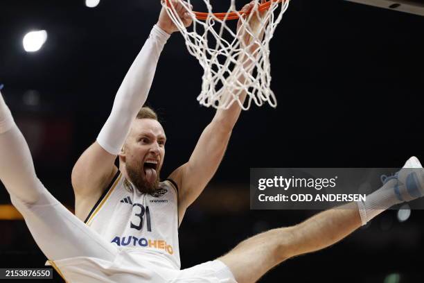 Real Madrid's Bosnian forward Dzanan Musa celebrates scoring during the Euroleague semi-final basketball match between Real Madrid Baloncesto and...