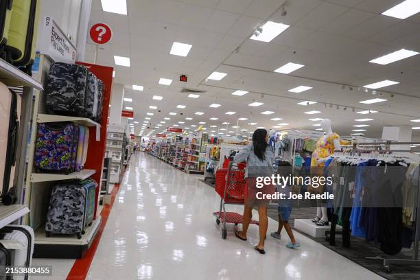 Customers shop at a Target store on May 20, 2024 in Miami, Florida. Target announced plans to cut prices on thousands of consumer basics as inflation...