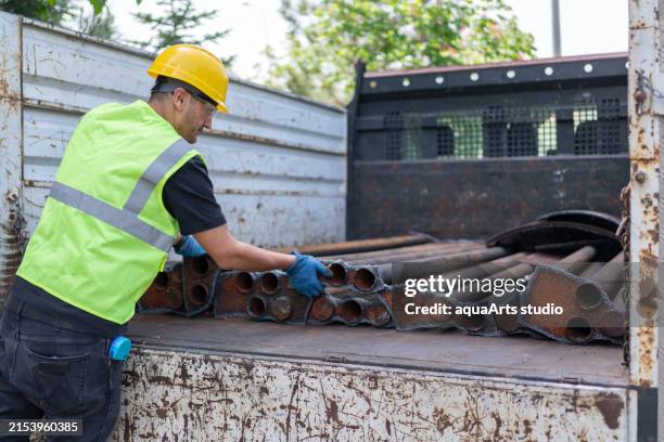 Contractor Loading 360 Contractor Loading Truck Stock Photos, High-Res Pictures, and ...