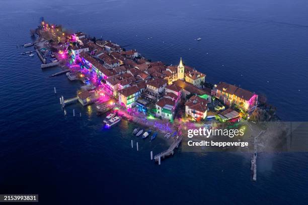 festive illumination on isola dei pescatori (fishermen's island), borromean gulf, lake maggiore - lake maggiore stock pictures, royalty-free photos & images