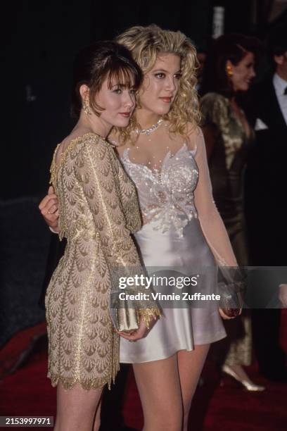 Actresses Tori Spelling, right, and Shannen Doherty at the 18th People's Choice Awards, Universal Studios Hollywood, Universal City, California,...