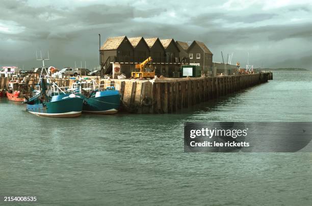 fishing boats at whitstable harbour england uk - whitstable stock pictures, royalty-free photos & images