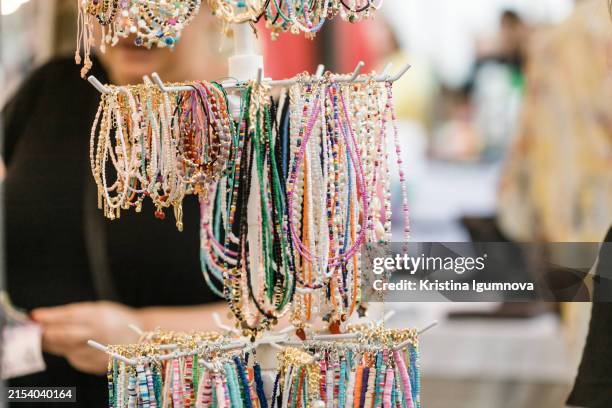 craft beads and bracelets at a street fair - festival of beads street carnival stock pictures, royalty-free photos & images