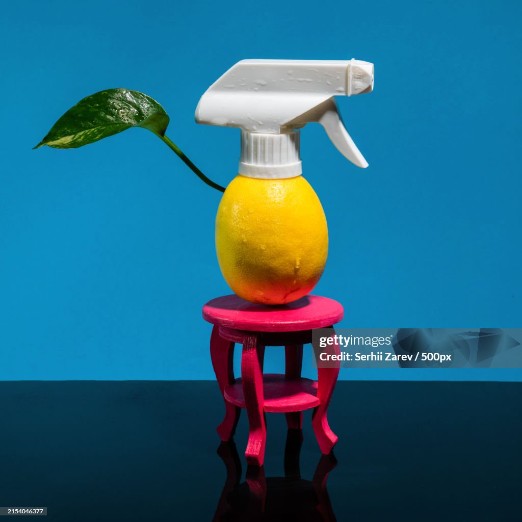 Composition with lemon and spray on a blue background,Odessa,Odesskaya,Ukraine