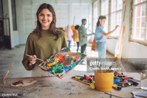 art class in progress: teacher and students engaged in painting - artist stock pictures, royalty-free photos & images