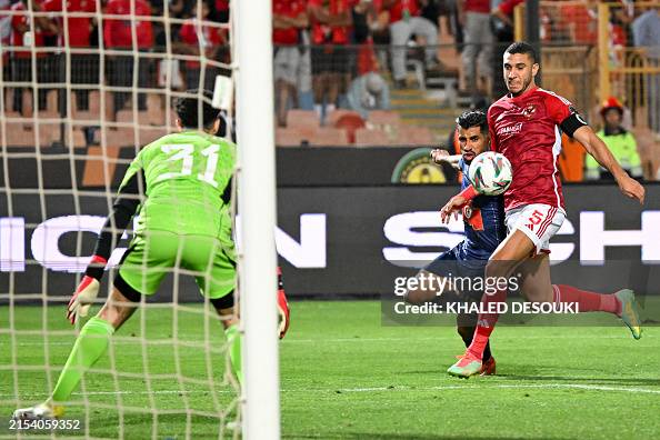 Ramy Rabiha Ahly's Egyptian defender Ramy Rabia vies for the ball with... News ...
