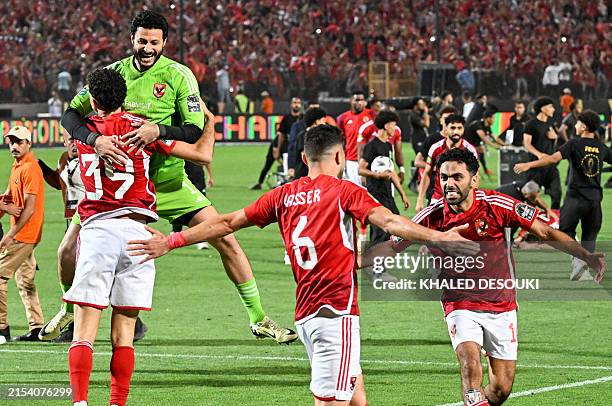 Ahly's players celebrate winning the second leg of the CAF Champions League final football match between Egypt's Al-Ahly and Tunis' Esperance...