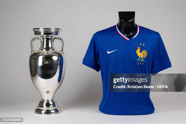View of the jersey of France next to the UEFA EURO trophy during the UEFA EURO 2024 Teams Jerseys Shoot at the UEFA Headquarters, The House of the...