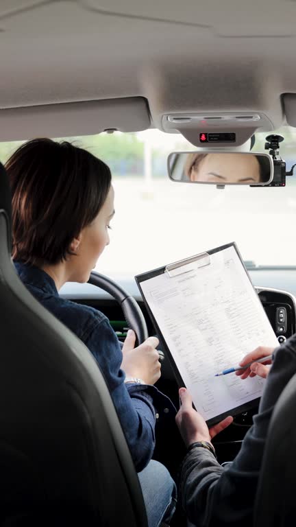 https://media.gettyimages.com/id/2154113708/video/arabic-male-driving-instructor-accepts-a-test-from-caucasian-female-student-during-practical.jpg?b=1&s=640x640&k=20&c=2i7hITd_4ojV1dP_d_C5hVrzkzfuwbHDIijTo5kNgqc=