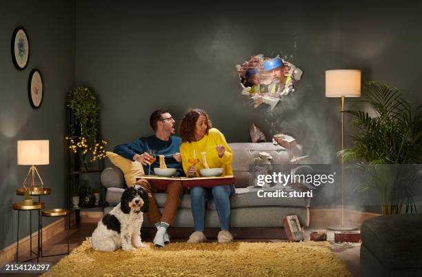 builder's mishap knock hole through wall - bad neighbor stock pictures, royalty-free photos & images