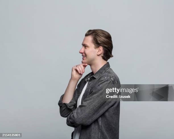 portrait of confident young man - profile view stock pictures, royalty-free photos & images