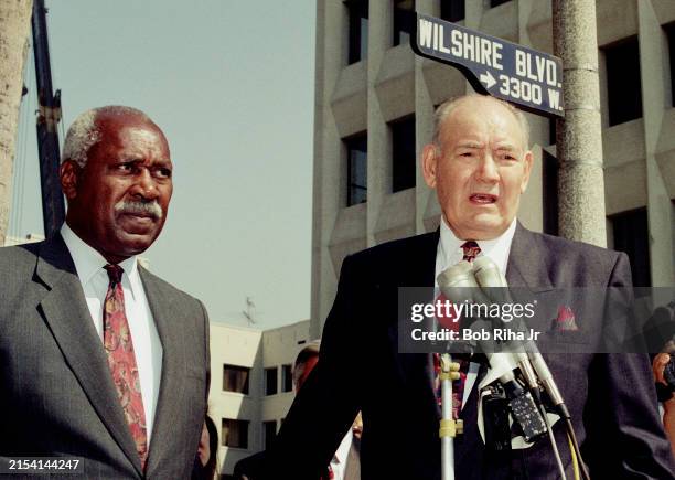 Los Angeles Politician Nate Holden listens to Los Angeles City Council Member John Ferraro speak during briefing on Los Angeles Police Department...