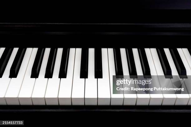 black and white piano keys close up, top view - piano key stock pictures, royalty-free photos & images