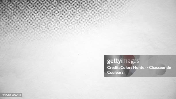 black and gray dots printed on white paper. macro photograph of an offset printed poster in paris, france. natural light. black and white. - poster printing stock pictures, royalty-free photos & images