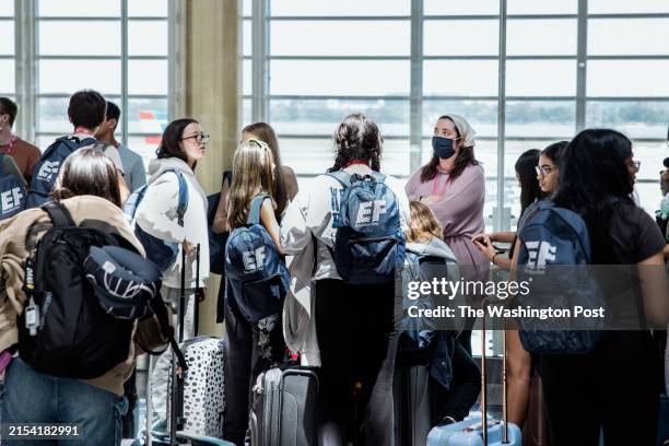 May 25, 2024: A masked person seen in a crowd of travelers at Reagan National Airport in Arlington, VA on May 25, 2024.