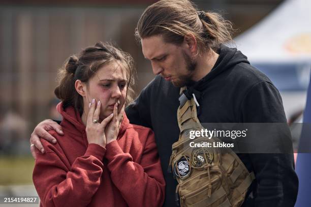 Local woman came to the State Emergency Service headquarters at the missile strike site to provide a DNA sample for identifying a deceased relative...