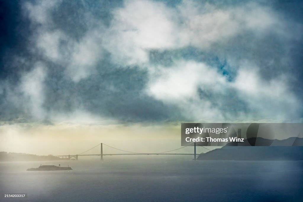 Golden Gate Bridge from a distance with moody sky