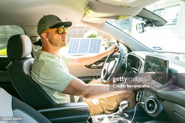 electric car driver and solar panels - location tracking stock pictures, royalty-free photos & images