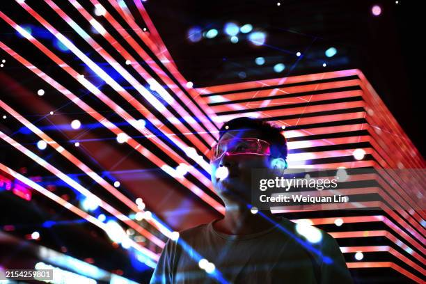 person wearing mixed reality smart glasses - invento fotografías e imágenes de stock