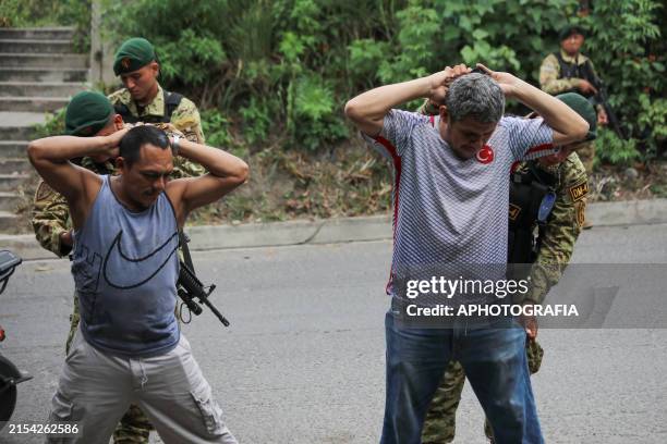 Salvadoran Army soldiers search residents during an anti-gang operation in the municipality of Apopa on May 26, 2024 in San Salvador, El Salvador....
