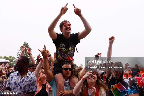Fans at the Snake Pit enjoy the performance by Sullivan King during the NTT IndyCar Series 108th Running of the Indianapolis 500 on May 26, 2024 at...