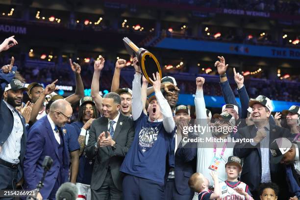 Head coach Dan Hurley and the Connecticut Huskies celebrates after the National College Basketball Championship game against the Purdue Boilermakers...