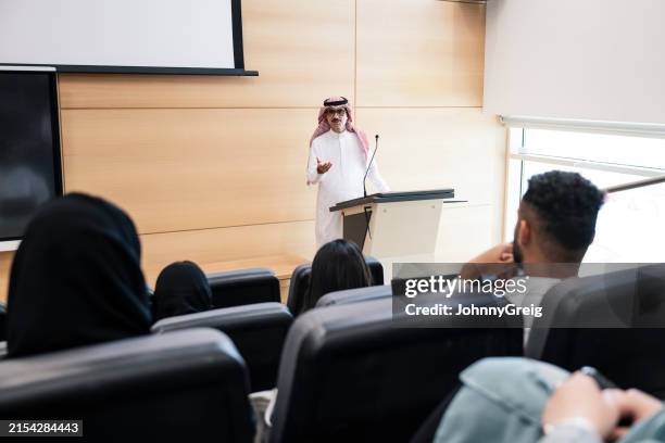 riyadh university professor lecturing to students - saudi classroom stock pictures, royalty-free photos & images