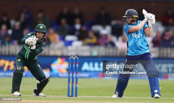 Heather Knight of England watches on, after being caught by Najiha Alvi of Pakistan off the bowling of Aliya Riaz of Pakistan during the 1st Women's...