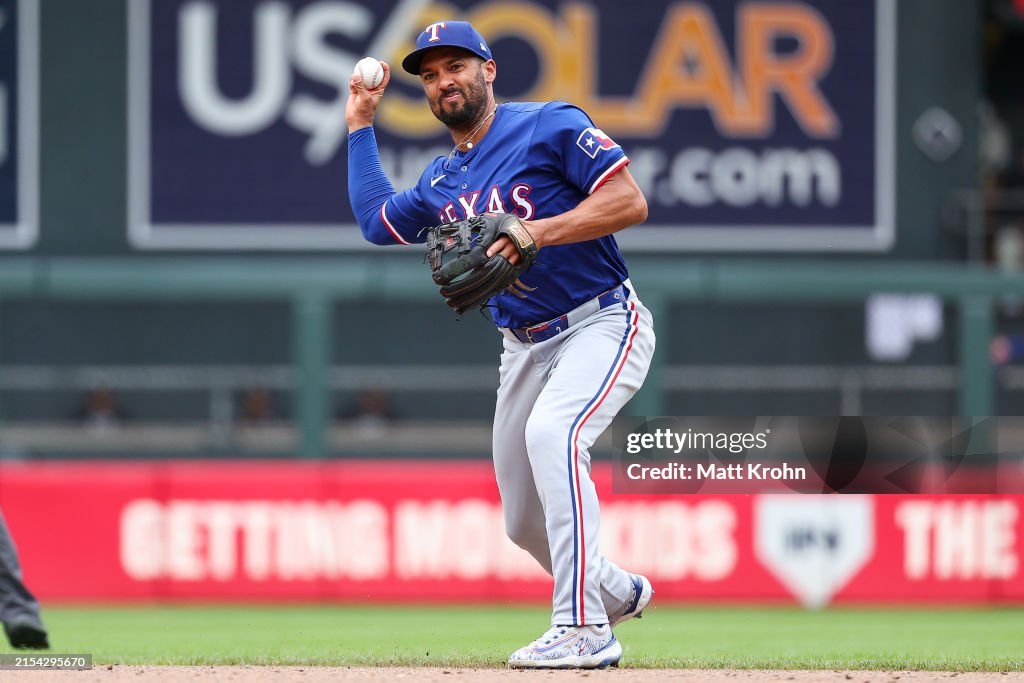 Marcus Ranger Marcus Semien of the Texas Rangers throws to first base to get out ...