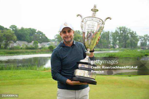 Richard Bland poses with the Alfred S. Bourne Trophy after winning the KitchenAid Senior PGA Championship at Harbor Shores Golf Club on Sunday, May...
