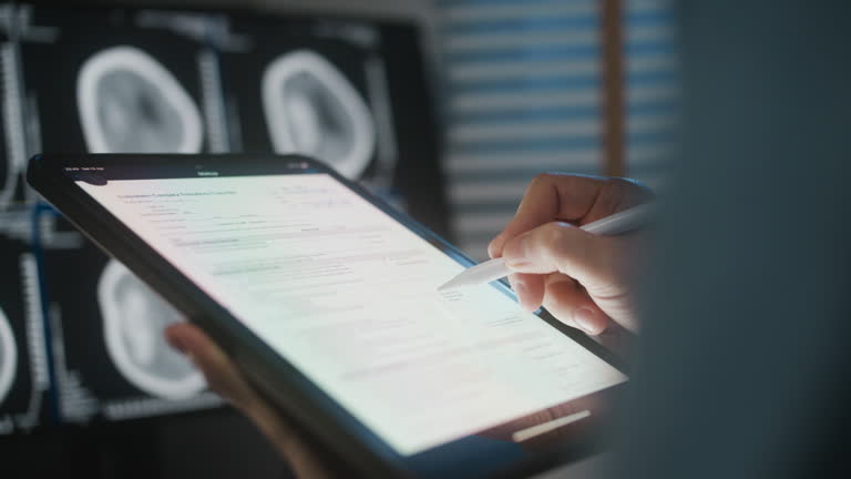 https://media.gettyimages.com/id/2154332662/video/nurse-reading-results-or-work-on-clinic-study-medical-exam-notes-or-healthcare.jpg?b=1&s=640x640&k=20&c=GvNncJpg1bsF9axoWMqCA0B85SCDCNXBS4qDCE2gMt0=