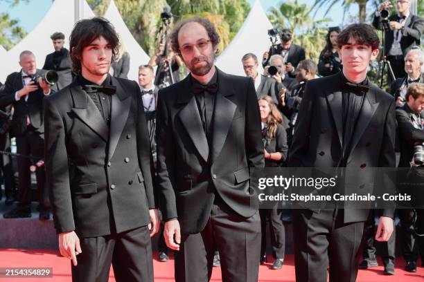 Roxan Bangalter, Thomas Bangalter and Tara-Jay Bangalter attend the "L'Amour Ouf" Red Carpet at the 77th annual Cannes Film Festival at Palais des...