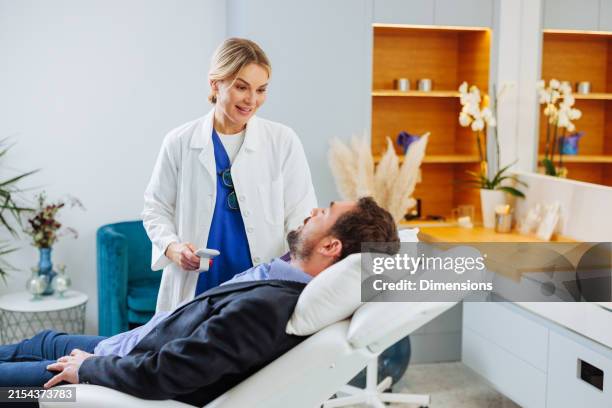 dermatologist discussing treatment with her patient - beautician stock pictures, royalty-free photos & images