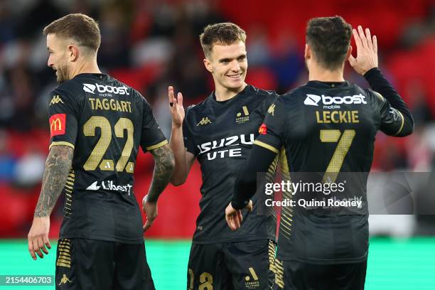Ben Old of the A-League All Stars celebrates with team mates after scoring a goal during the exhibition match between A-League All Stars Men and...