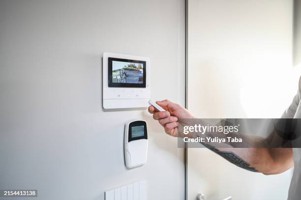 remote control on the video intercom - modern door bell stock pictures, royalty-free photos & images