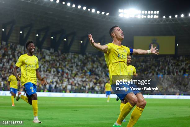 Cristiano Ronaldo of Al Nassr celebrates after scoring the 2nd goal during the Saudi Pro League match between Al-Nassr and Al-Ittihad at Al Awwal...