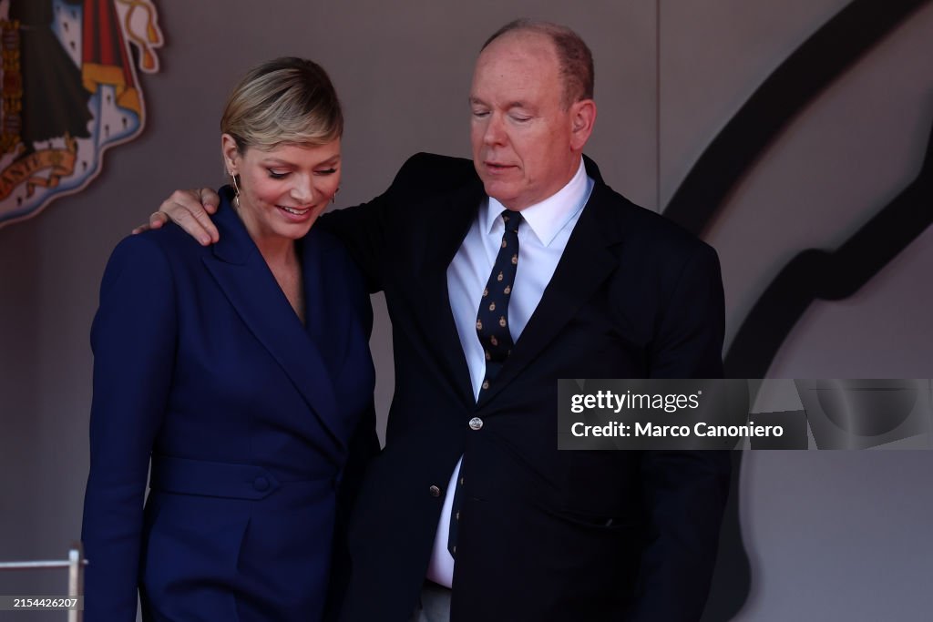 HSH Prince Albert II of Monaco (R) embraces Princess HSH...