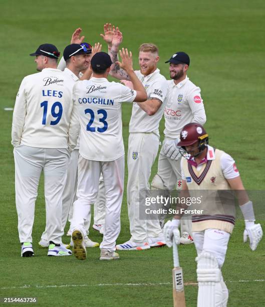 Durham bowler Ben Stokes celebrates with team mates after taking the wicket of Josh Davey during day one of the Vitality County Championship match...