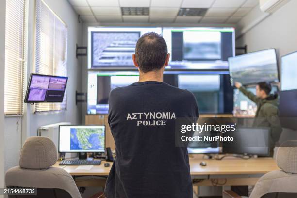 Police officer checks the screens monitoring the borders for migrants entering the Greek and European territory illegally. The control room of the...
