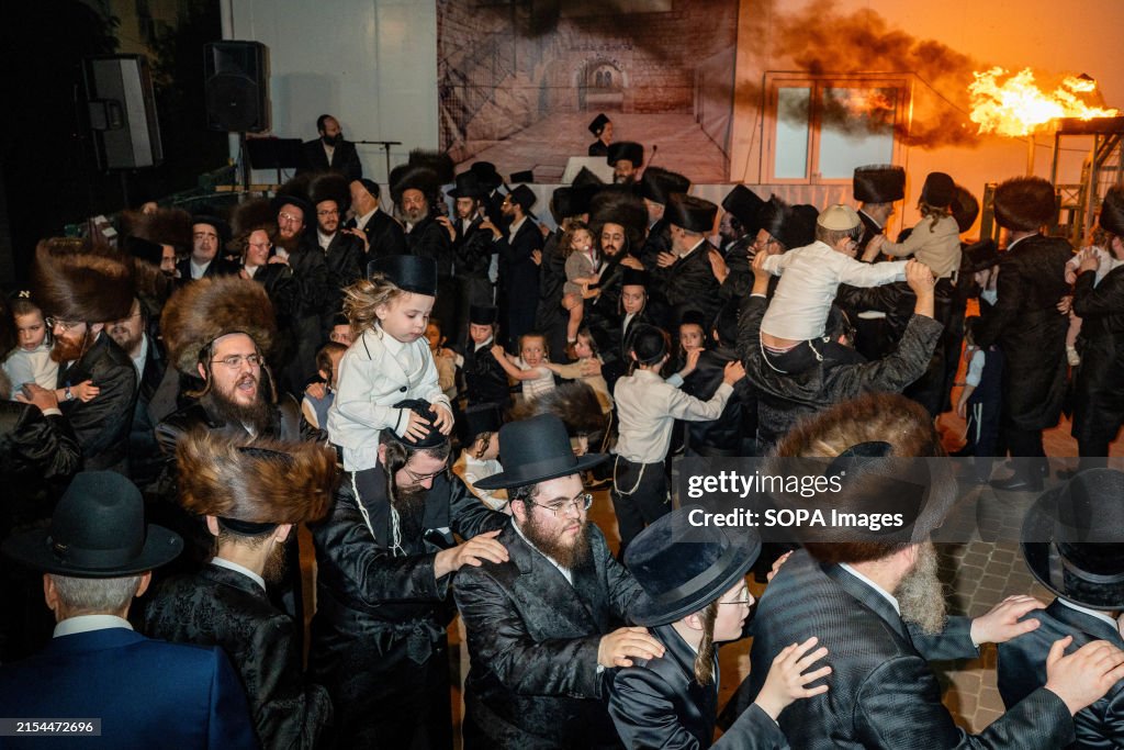 Hasidic orthodox, Jewish men, sing and dance during Lag Ba'...