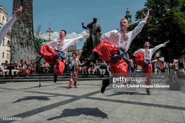 Dancers of ‘Verkhovyna’ folk song and dance ensemble perform near the monument to Ukrainian poet Taras Shevchenko on May 23, 2024 in Lviv, Ukraine.