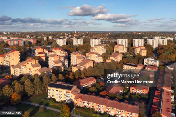 apartment buildings in autumn on a sunny day - solna stock pictures, royalty-free photos & images