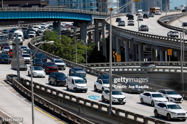 Vehicles travel along I-95 on May 24, 2024 in Miami, Florida. AAA predicts that nearly 44 million Americans expect to travel at least 50 miles from...