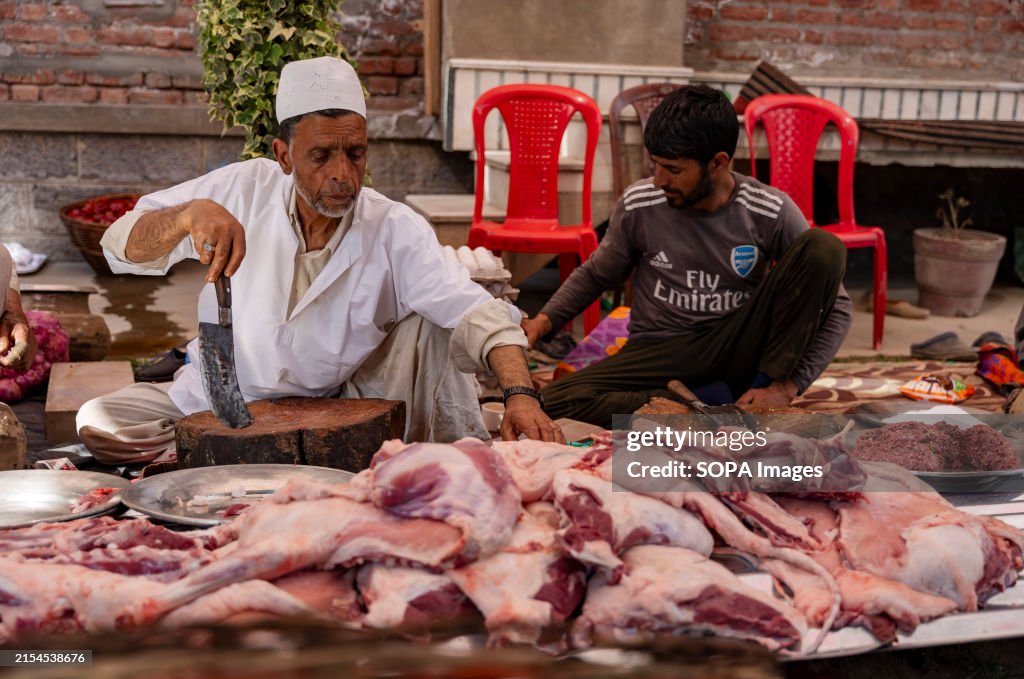 Traditional Kashmiri chefs cut lamb meat to prepare wazwan...