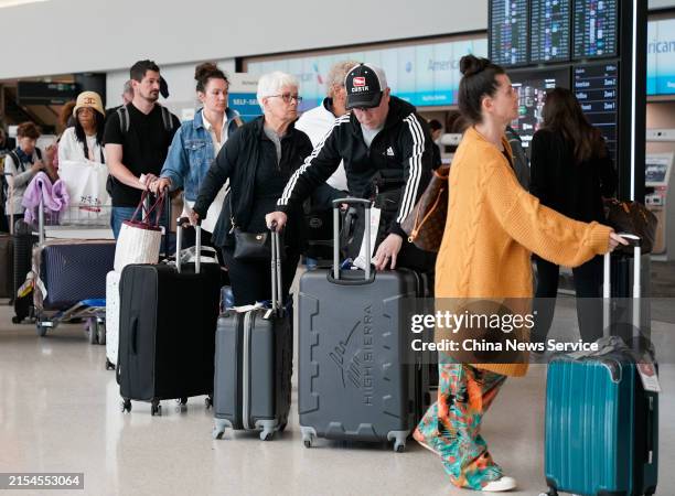 Passengers check in at San Francisco International Airport on May 24, 2024 in San Francisco, California. An estimated 43.8 million Americans will...