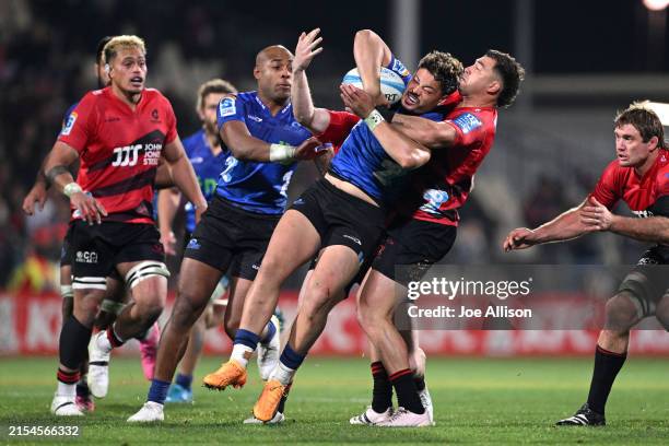 Lam of the Blues is tackled by David Havili of the Crusaders during the round 14 Super Rugby Pacific match between Crusaders and Blues at Apollo...